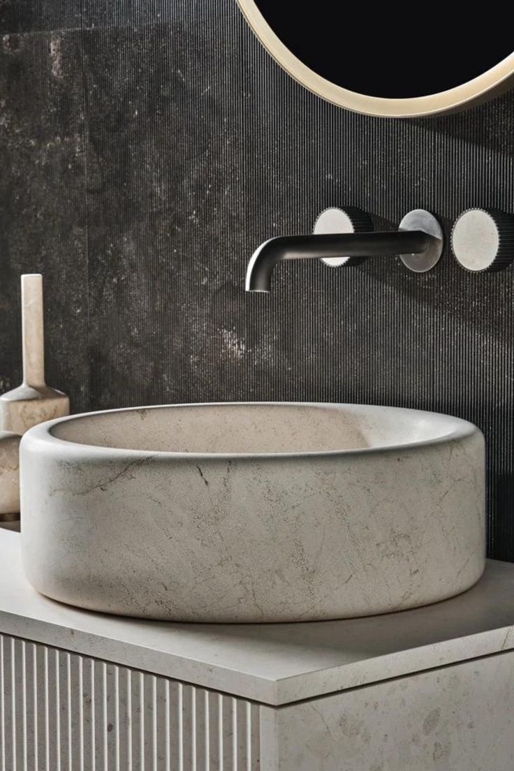 PRODUCTS chic bathroom with fluting details, a vessel sink, & wall mounted faucet